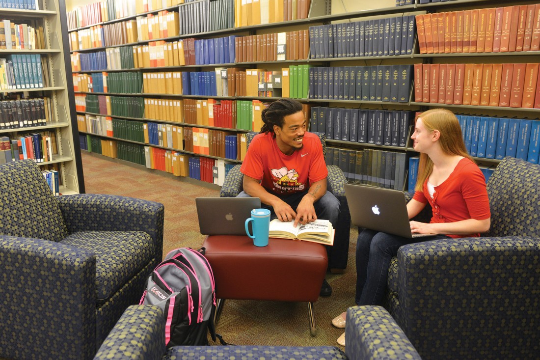 Students studying in library